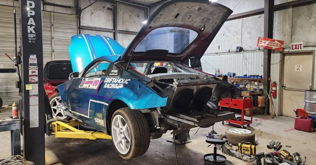 Drift car on a lift during preventive maintenance and inspection